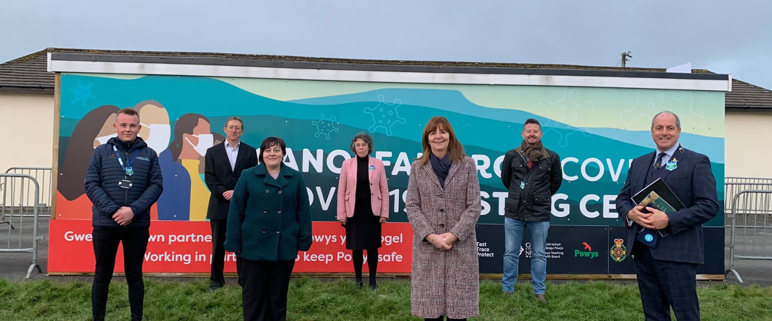 Outside the asymptomatic testing centre are (from left to right) Jake Offord, Powys County Council’s Interim Asymptomatic Testing lead; Nigel Brinn, Powys County Council’s Executive Director for Economy and Environment; Cllr Beverley Baynham, Powys County