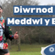 Testun yn Darllen: Diwrnod Iechyd Meddwl y byd 2026. Delwedd o Wayne mewn sefyllfa rhedeg.