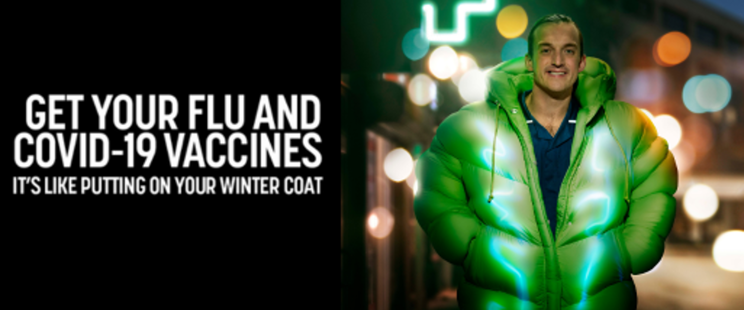 Man in warm winter coat with text "get you flu and COVID-19 vaccinations"