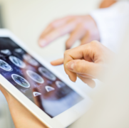 Medical-team-analyzing-MRI-scans-on-digital-tablet