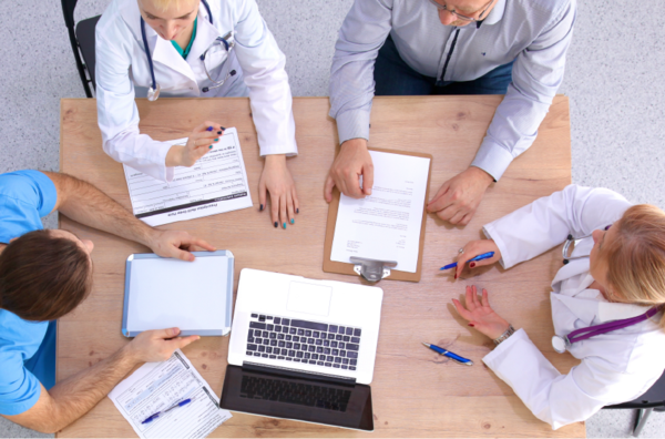 A group of professionals working around a table