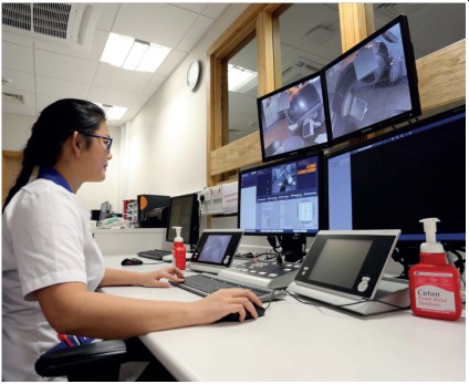 Image of radiographer at control panel