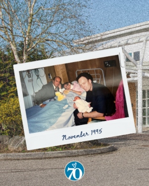 A polaroid photo of a baby being introduced to a grandmother in a hospital bed.
