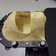 A plastic facemask with holes