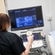 A person uses a medical scanning device.