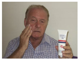 Man applying skin cream