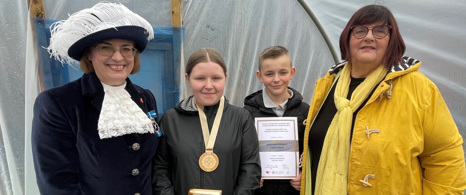 Morgan and Seren receive their award from the High Sheriff and Donna Mead.