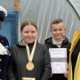 Morgan and Seren receive their award from the High Sheriff and Donna Mead.