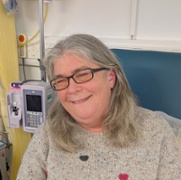 Head and shoulders of patient Lesley Jenkins sitting in the clinical trials unit