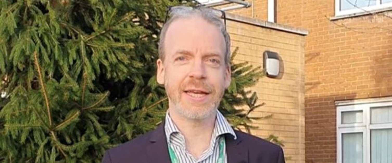 Mark Taubert smiles outside Velindre Cancer Centre.