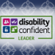 A navy background with the Trust logo on, and a logo displaying our Disability Confident Level 3 Status.