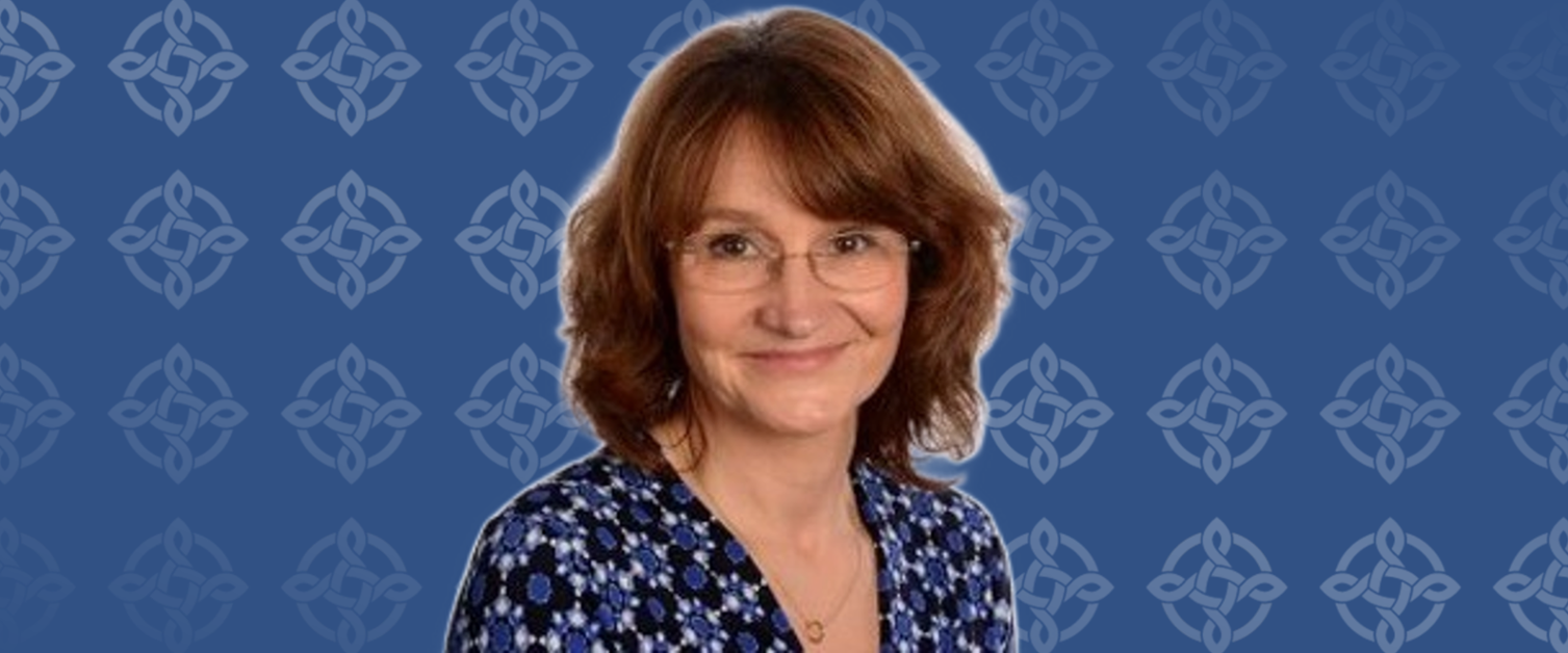 A woman smiling at the camera.