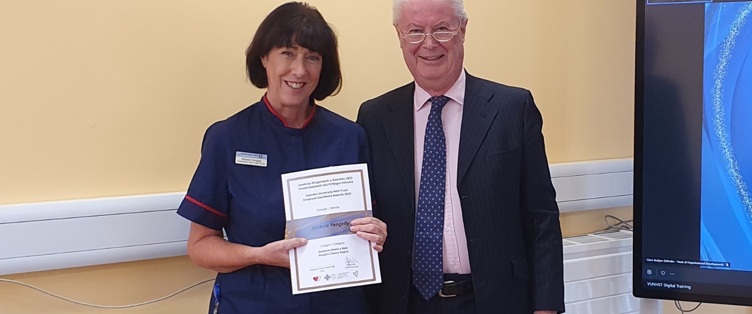 Michelle Pengelly receives her award from Gareth Jones.