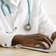 A consultant uses a laptop.