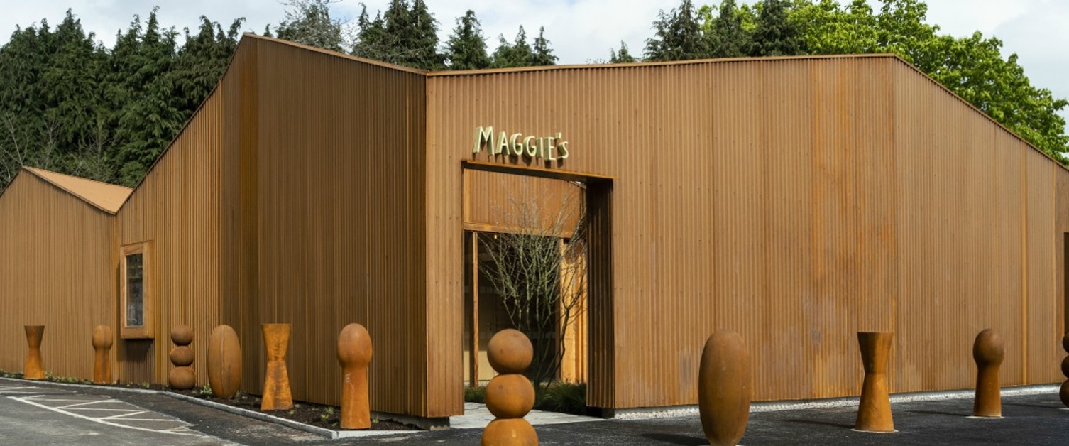 A building with sculptures in front of it.