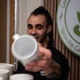 A man is passing a cup.