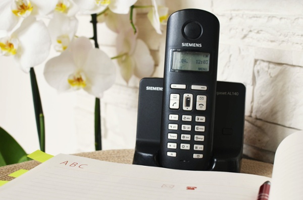 A black landline telephone.
