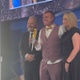 An award is presented on stage.