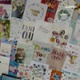 A wall is covered by thank you cards.