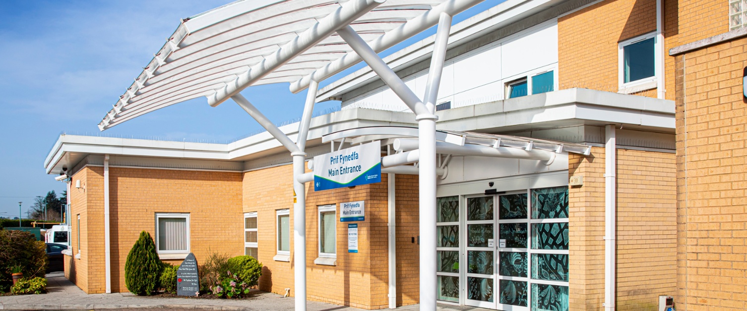 The front entrance of Velindre Cancer Centre in the sun.