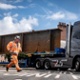 A steel beam is being transported on a lorry to the new Velindre Cancer Centre.